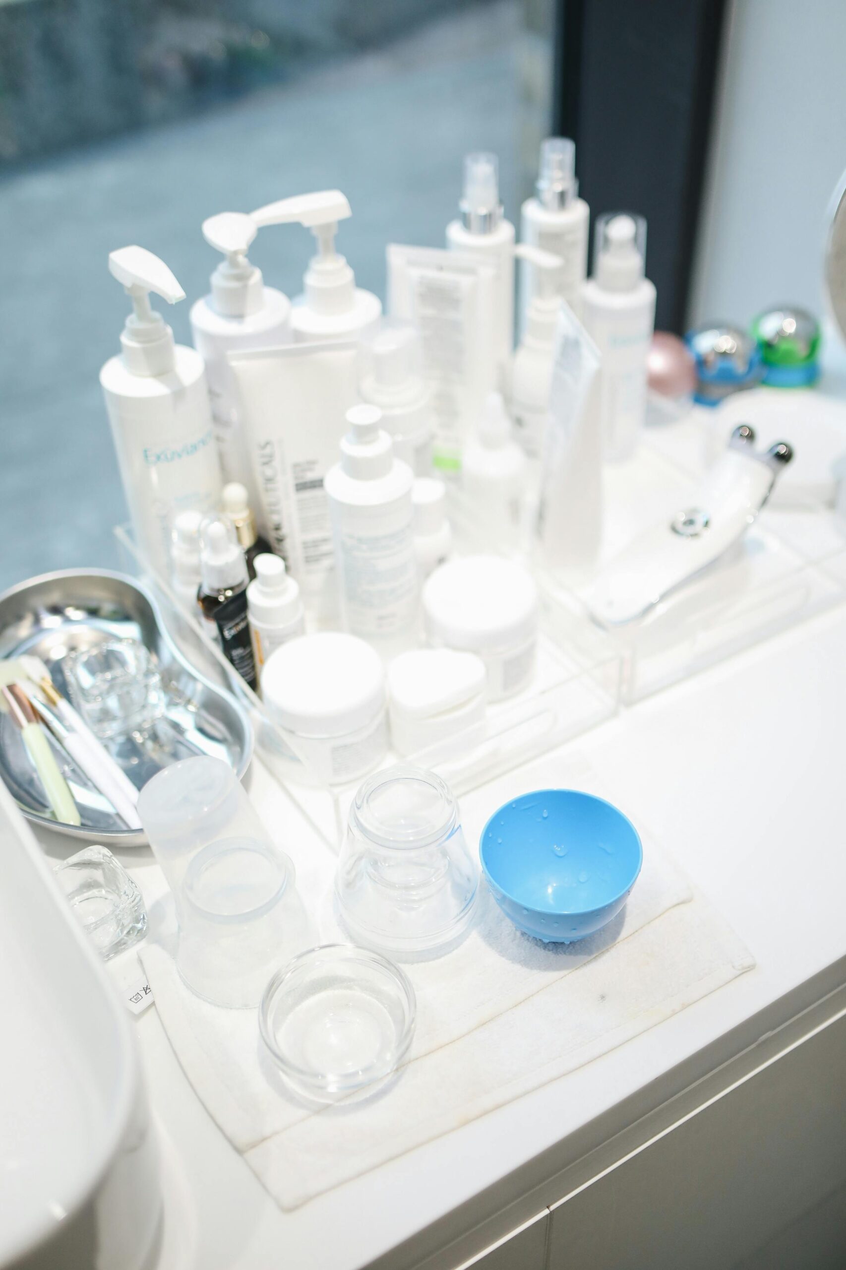 A clean and organized display of skin care products and beauty tools in a salon setting.